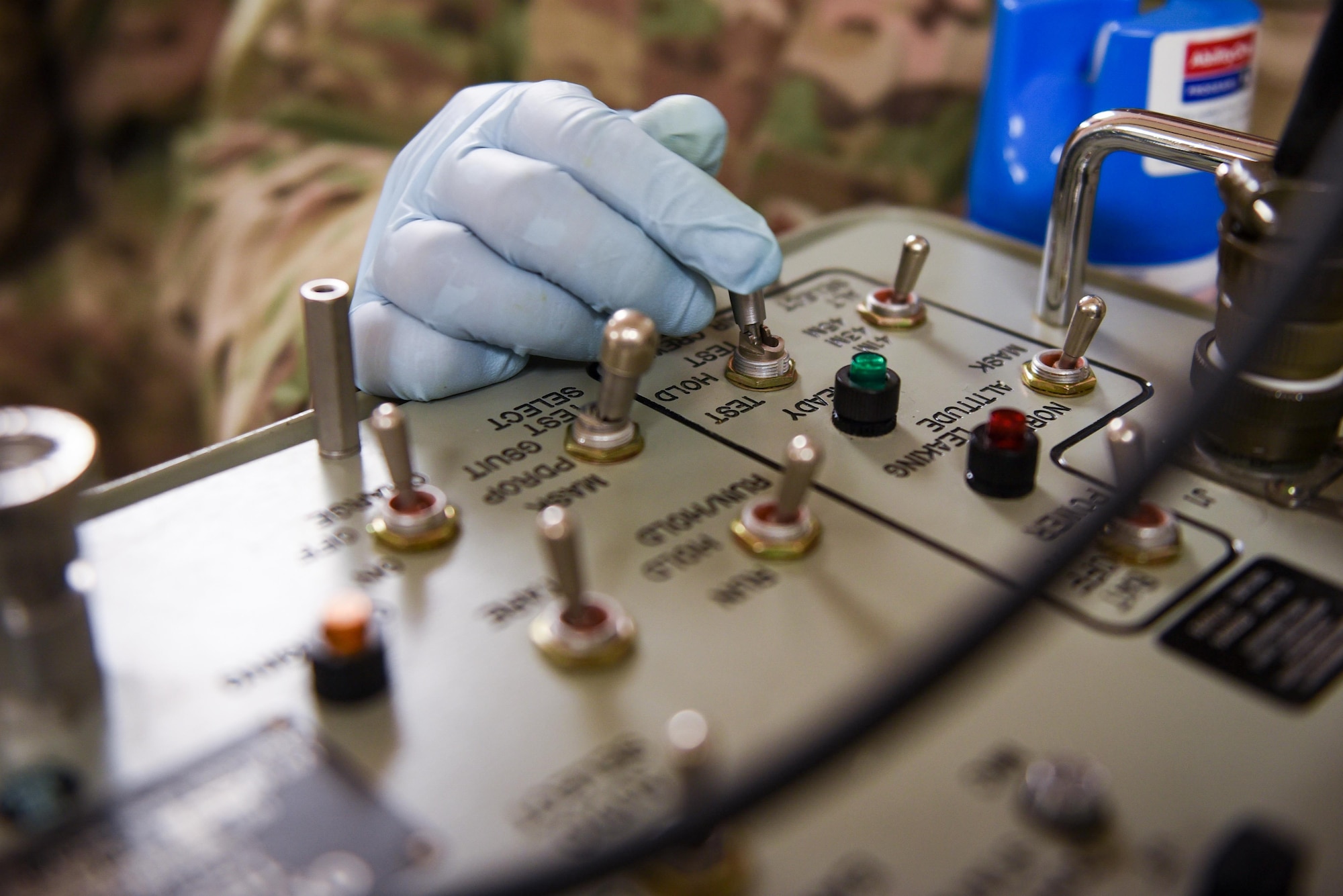 SSgt Carmen Lopez-Torres, an aircrew flight equipment technician with the 1st Special Operations Support Squadron, operates a scot tester at Hurlburt Field, Fla., June 15, 2017. A scot tester is used to test the seal of an oxygen mask, ensuring the mask is fitted properly and functions correctly in the event aircrew members need to utilize oxygen during flight. (U.S. Air Force photo by Staff Sgt. Jeff Parkinson)