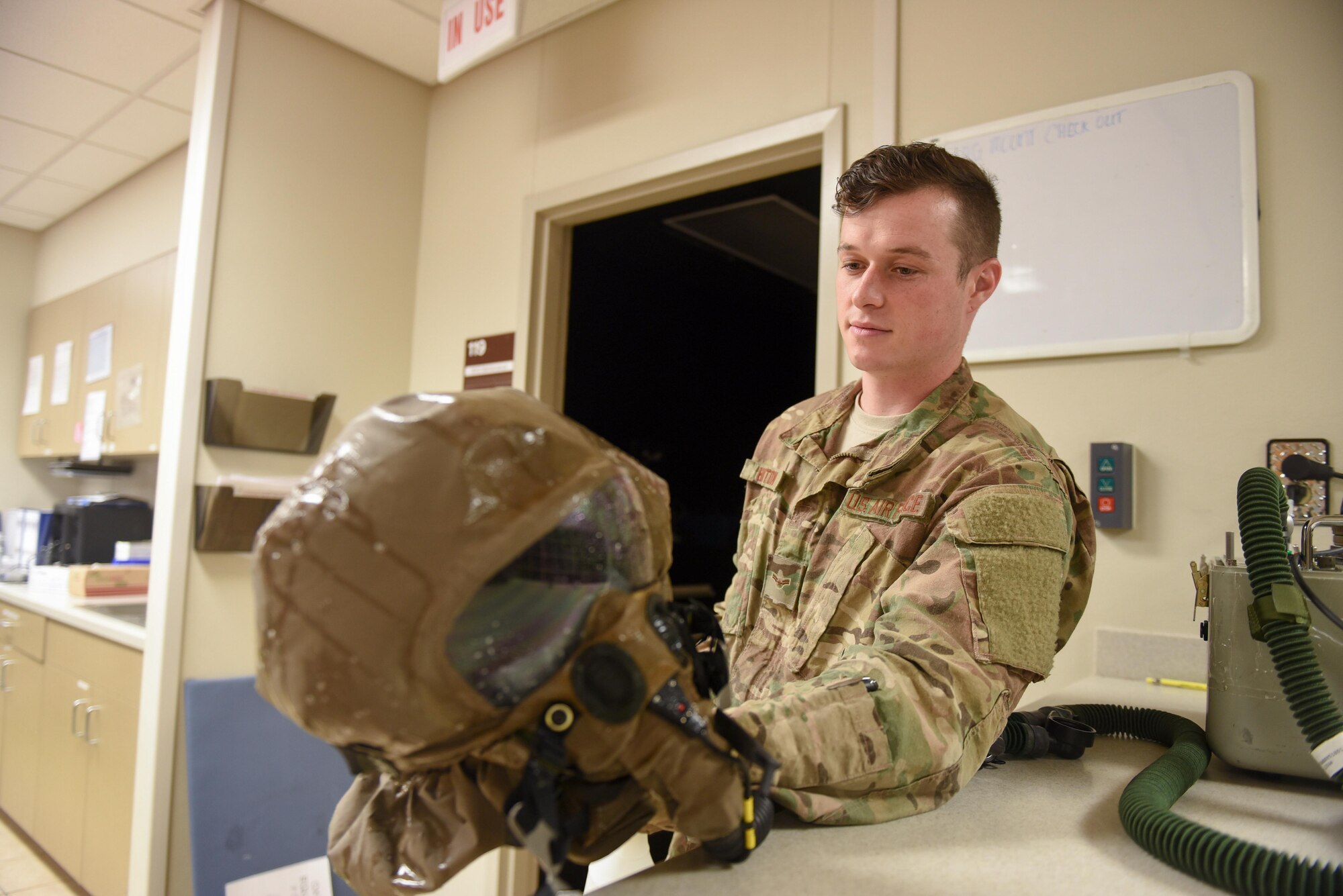 Airman 1st Class Cody Houston, an aircrew flight equipment technician with the 1st Special Operations Support Squadron, tests an MBU-19/P chemical protection mask at Hurlburt Field, Fla., June 15, 2017. Mask are cleaned with soapy water and inflated to test for air leaks. (U.S. Air Force photo by Staff Sgt. Jeff Parkinson)