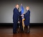 Maj. Gen. Darryl Burke (left), Air Force District of Washington commander, receives the 79th Medical Wing guidon from Col. Sharon Bannister, former 79th Medical Wing commander, during an in-activation ceremony June 16, 2017 at Joint Base Andrews, Md. Bannister had led the wing since assuming command 2015 and its approximately 1,500 Air Force health care professionals operating in eight locations and providing Air Force medical forces for expeditionary deployment, homeland defense operations and operations worldwide. (Photo by Staff Sgt. Joe Yanik)