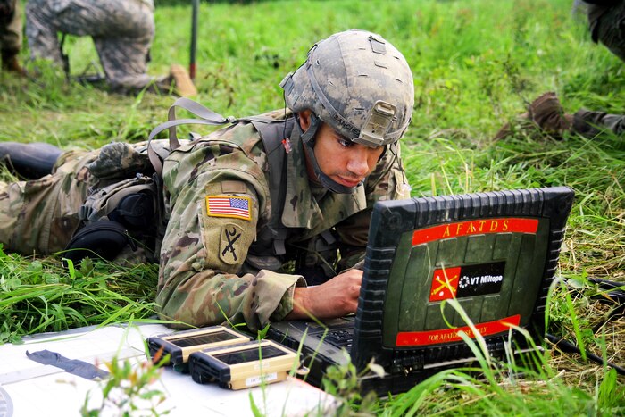 Army Sgt. Victor Sanchez operates an advanced field artillery tactical data system to calculate aiming data for an M119A2 105mm howitzer during an air assault artillery raid at Fort Drum, N.Y., June 9, 2017. Sanchez is a fire direction coordinator assigned to Alpha Battery, 1st Battalion, 258th Artillery Regiment, 27th Infantry Brigade Combat Team of the New York Army National Guard. Army photo by Sgt. Alexander Rector 