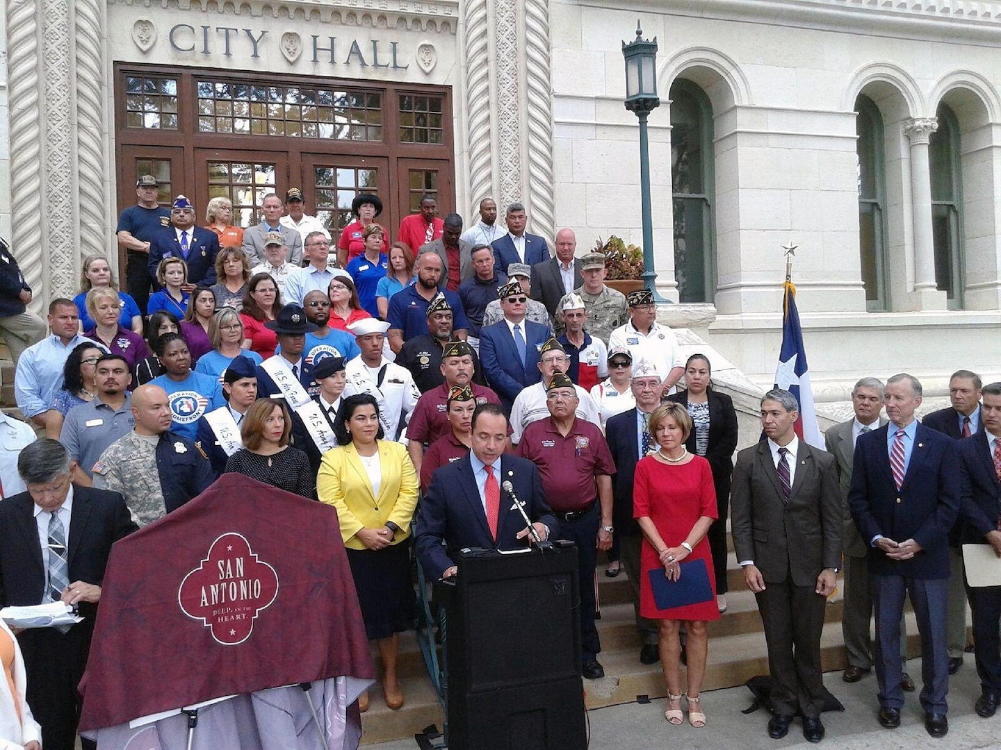 Texas State Senator Jose Menendez (District 26) speaks to those gathered at the unveiling ceremony for the newly trademarked Military City USA logo at City Hall June 19.