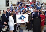 City of San Antonio Mayor-Elect Ron Nirenberg and others pose with the newly revealed official logo for "Military City USA" during a ceremony at City Hall June 19. “For years many have referred to San Antonio as Military City, USA and now we are officially a registered trademark, a name that no other city can claim.  Our relationship with the military is one of the many reasons our city continues to prosper and we are proud to celebrate this historic announcement,” Nirenberg said. “Thank you to the entire military community, their families, and the service men and women who call San Antonio home.”