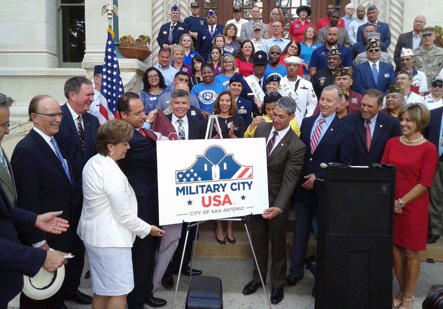 City of San Antonio Mayor-Elect Ron Nirenberg and others pose with the newly revealed official logo for "Military City USA" during a ceremony at City Hall June 19. “For years many have referred to San Antonio as Military City, USA and now we are officially a registered trademark, a name that no other city can claim.  Our relationship with the military is one of the many reasons our city continues to prosper and we are proud to celebrate this historic announcement,” Nirenberg said. “Thank you to the entire military community, their families, and the service men and women who call San Antonio home.”