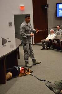 Staff Sgt. August O’Niell, the U.S. Air Force’s first pararescue amputee to continue to serve on active duty, speaks to members of the Air Force Technical Applications Center, Patrick AFB, Fla., during the center’s Combat Airman Fitness Day May 22, 2017.  Pictured with O’Niell is his loyal companion, Kai, a service dog who O’Niell obtained through the K9 Soldiers program. (U.S. Air Force photo by Susan A. Romano)