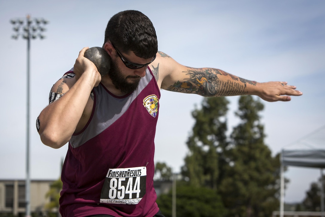 Marine Corps veteran Zach Guess competes in the shot put event during the 2017 Marine Corps Trials Field Competition at Marine Corps Base Camp Pendleton, Calif., March 10, 2017. Marine Corps photo by Lance Cpl. Ariana Acosta