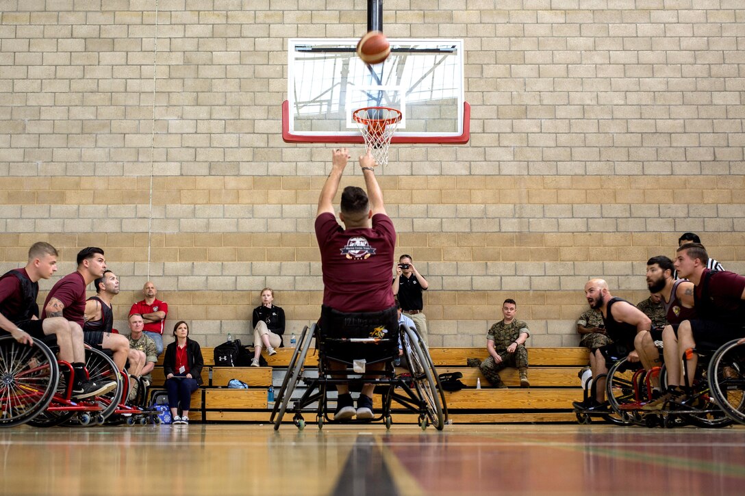 Marine Corps Cpl. Kinna Brendan shoots a free throw during the Marine Corps Trials' wheelchair basketball competition at Marine Corps Base Camp Pendleton, Calif., March 14, 2017. Marine Corps photo by Lance Cpl. Roderick Jacquote