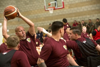 Marine Corps veteran Jack Stanfield protects the ball in a wheelchair basketball competition during the Marine Corps Trials at Marine Corps Base Camp Pendleton, Calif., March 14, 2017. The trials promote recovery and rehabilitation through adaptive sport participation and develops camaraderie among recovering service members and veterans. Marine Corps photo by Lance Cpl. Roderick Jacquote