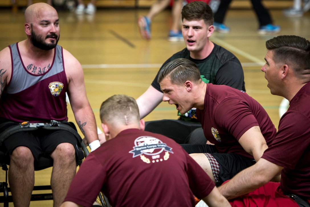 Marine Corps Cpl. John Fox encourages his teammates before the final game of the 2017 Marine Corps Trials Wheelchair Basketball Competition at Marine Corps Base Camp Pendleton, Calif., March 14, 2017. Marine Corps photo by Lance Cpl. Ariana Acosta