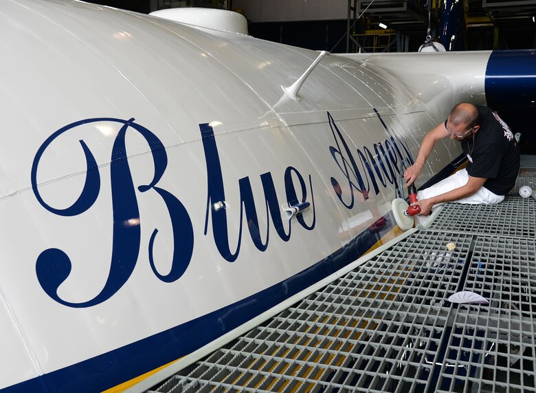 Using a buffer and wax, 576th Aircraft Maintenance Squadron aircraft painter Brandon Barney ensures Fat Albert  is shined and ready to roll out of the paint hangar on May 31 at Hill Air Force Base, Utah. (U.S. Air Force Photo by Alex R. Lloyd)