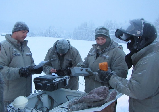 Airmen stationed at Detachment 460, Eielson AFB, Alaska, conduct maintenance at one of their seismic arrays in support of the Air Force Technical Applications Center’s nuclear treaty monitoring mission.  (U.S. Air Force photo)