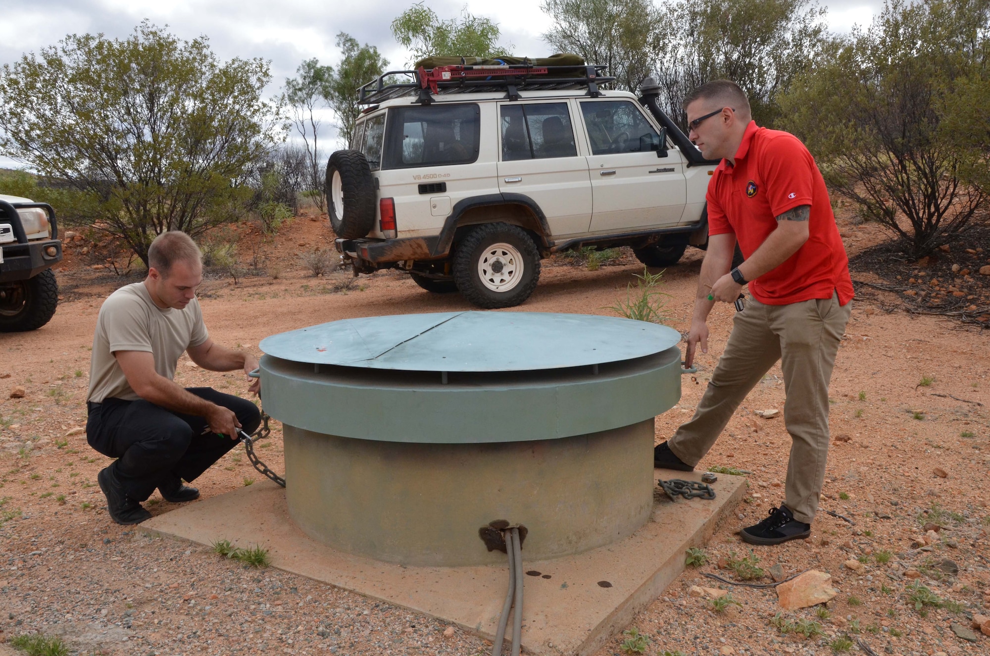 Airmen stationed at Detachment 421, Alice Springs, Australia, conduct maintenance at one of their seismic arrays in support of the Air Force Technical Applications Center’s nuclear treaty monitoring mission.  (U.S. Air Force photo by Susan A. Romano)

