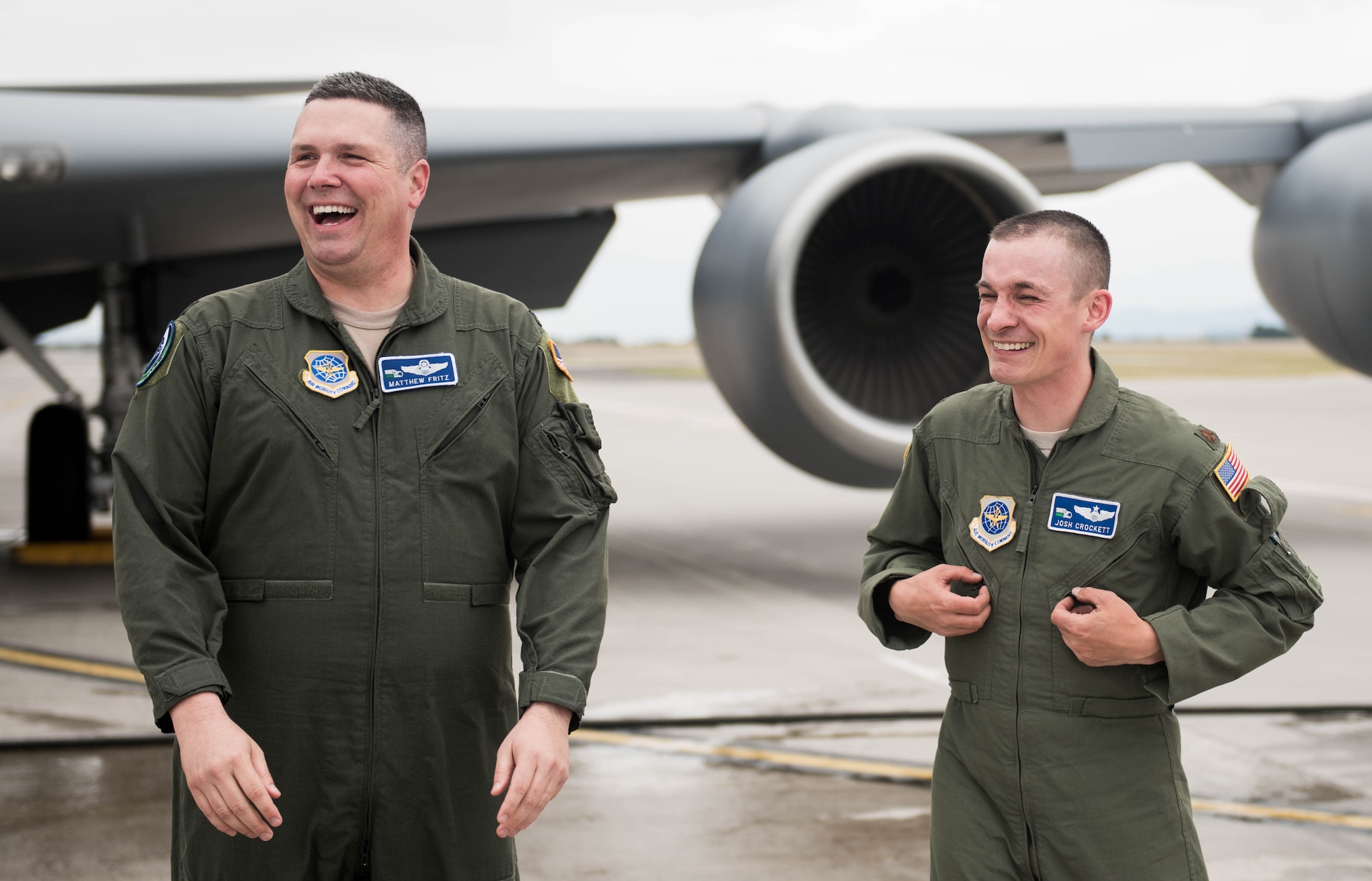 Col. Matthew Fritz, 92nd Air Refueling Wing vice commander, and Maj. Joshua Crockett, 92nd ARW executive officer, laugh following the celebration of Fritz’s final flight June 15, 2017, at Fairchild Air Force Base, Washington. Crockett has worked in the command section since September 2016. (U.S. Air Force photo/Senior Airman Sean Campbell)