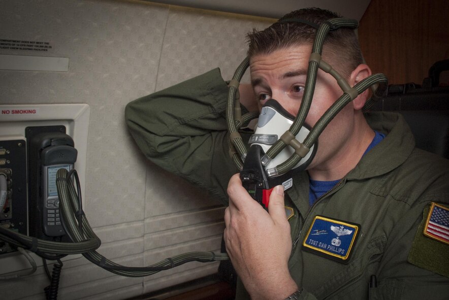U.S. Air Force Tech. Sgt. Christopher Phillips, a communication systems operator assigned to the 310th Airlift Squadron, tests the oxygen system during a pre-flight inspection at MacDill Air Force Base, Fla., May 5, 2017. Pre-flight inspections are done before every flight to ensure the aircraft is ready for flight. (U.S. Air Force photo by Airman 1st Class Mariette Adams)