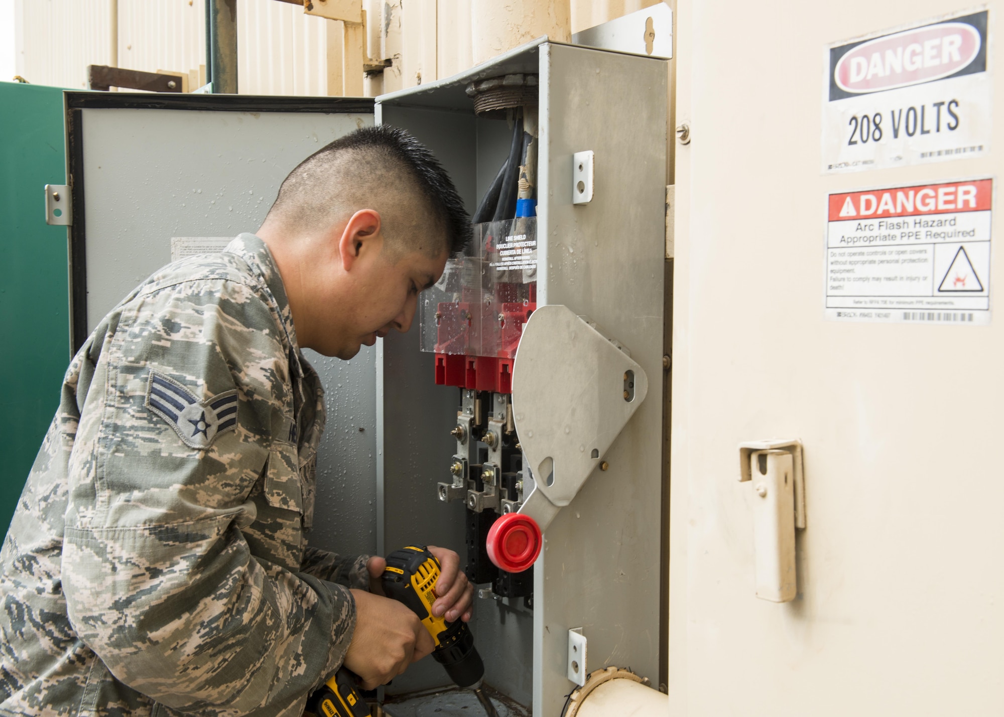 U.S Air Force Senior Airman Jesus H. Hernandez, 7th Civil Engineer Squadron Electrical Power Production journeymen, repair a generator at Dyess Air Force Base, Texas, June 1, 2017. Electrical Airmen are responsible for a ensuring all generators on the base are functional at all times in the event a power outage occurs. (U.S. Air Force photo by Airman 1st Class Katherine Miller)