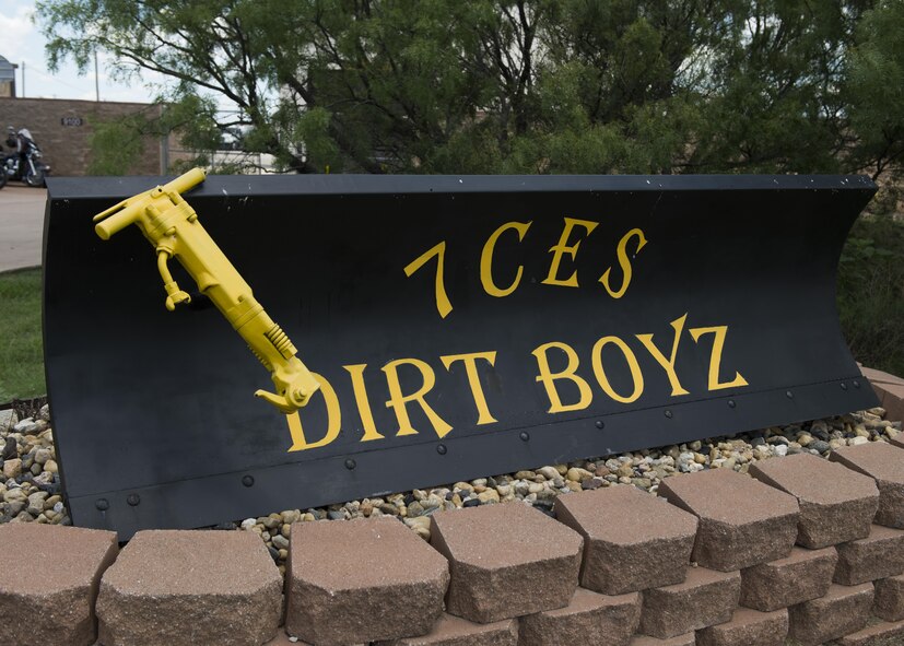 A plow monument reading “7 CES DIRT BOYZ” is located at the 7th Civil Engineer Squadron at Dyess Air Force Base, Texas, June 6, 2017. Pavements and heavy equipment Airmen of the 7th CES are often referred to as the “Dirt Boyz” due to their constant presence in dirty situations. (U.S. Air Force photo by Airman 1st Class Katherine Miller