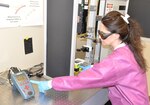 Dr. Nancy Millenbaugh, research chemist and principal investigator for the Craniofacial Health and Restorative Medicine Directorate at Naval Medical Research Unit San Antonio, points to a laser beam that is used in testing the effectiveness of nanoparticle targeted laser therapy in improving the treatment of multi-drug resistant wound infections, especially for servicemembers with maxillofacial injuries from combat. Researchers are hoping to develop a nanoparticle laser therapy that can breakdown biofilms, which contain a protective coating produced by bacteria that make infections in the wound resistant to antibiotic treatment.