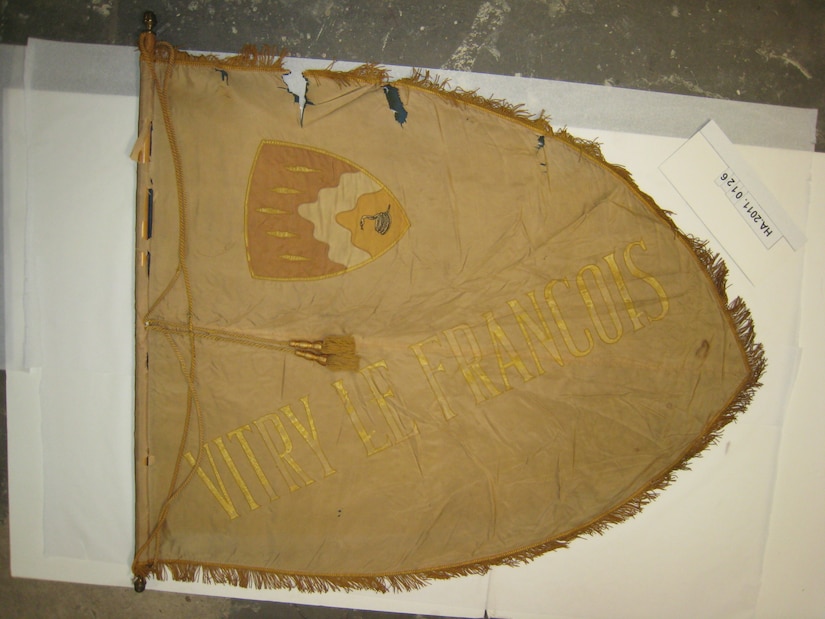 A World War I banner depicting the 369th coat of arms and the name Vitry-le-Francois, a French village located in North-Eastern France on the Marne River. (Courtesy photo by NY State Military History Museum, Saratoga Springs, N.Y.)