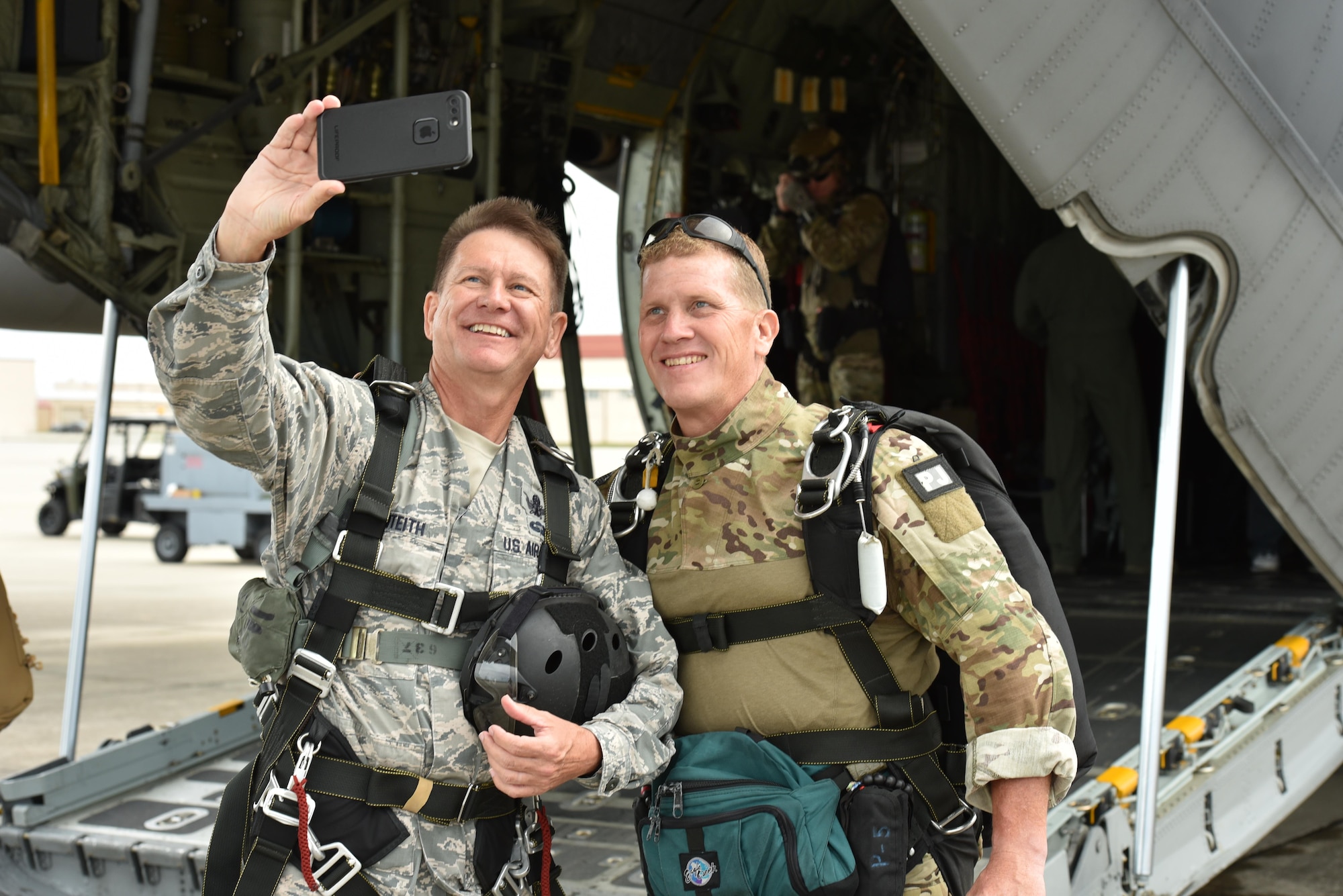 Brig. Gen. Wayne R. Monteith, 45th Space Wing commander, shoots a selfie with Chief Master Sgt. Mike Ziegler, pararescueman and senior enlisted member, 308th Rescue Squadron, June 8, 2017, prior to boarding a 920th Rescue Wing combat-search-and-rescue aircraft, where Ziegler will serve as the general's tandem jump master allowing him to skydive.  Leadership at both the 45th SW and the 920th RQW co-located at Patrick Air Force Base, Florida, agreed to demonstrate their commitment to mutual-support and shared resources in an unforgettable way. (U.S. Air Force photo / Senior Airman Brandon Kalloo Sanes)