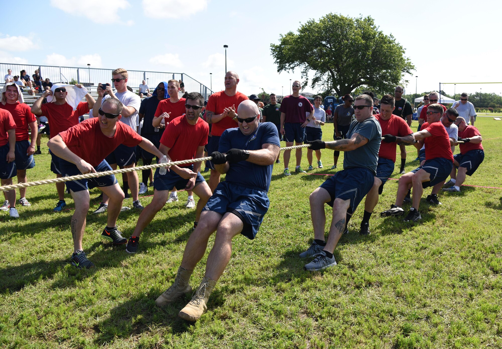 Members of the 81st Mission Support Group participate in a tug-of-war competition during field day June 15, 2017, on Keesler Air Force Base, Miss. Field day was the final event of Wingman Week, which focused on the physical pillar of Comprehensive Airman Fitness, resiliency and teambuilding initiatives across the base. (U.S. Air Force photo by Kemberly Groue)