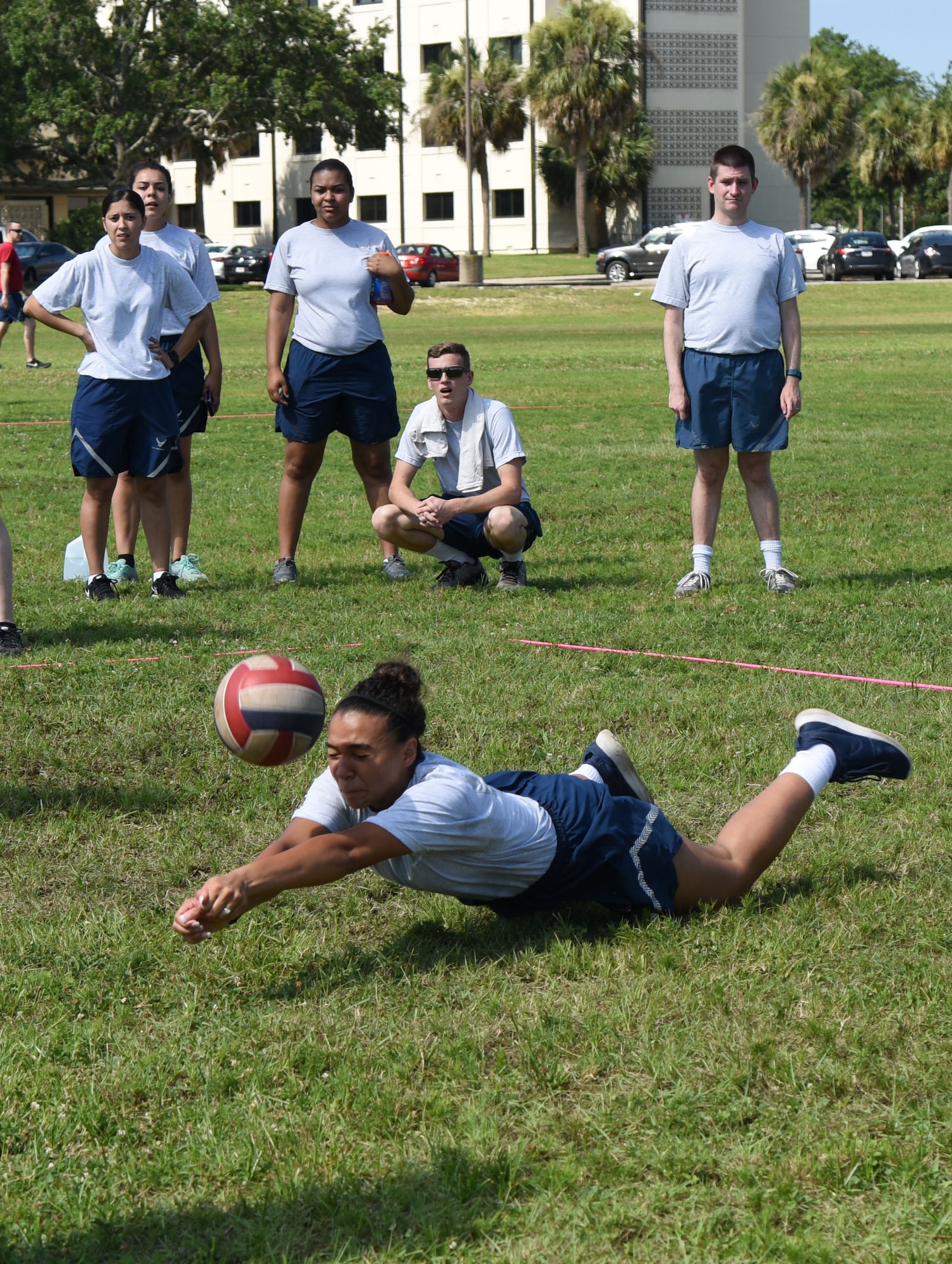 Airman 1st Class Aneesa Smith, 81st Medical Operations Squadron mental health technician, dives to hit the ball during a volleyball competition during field day June 15, 2017, on Keesler Air Force Base, Miss. Field day was the final event of Wingman Week, which focused on the physical pillar of Comprehensive Airman Fitness, resiliency and teambuilding initiatives across the base. (U.S. Air Force photo by Kemberly Groue)