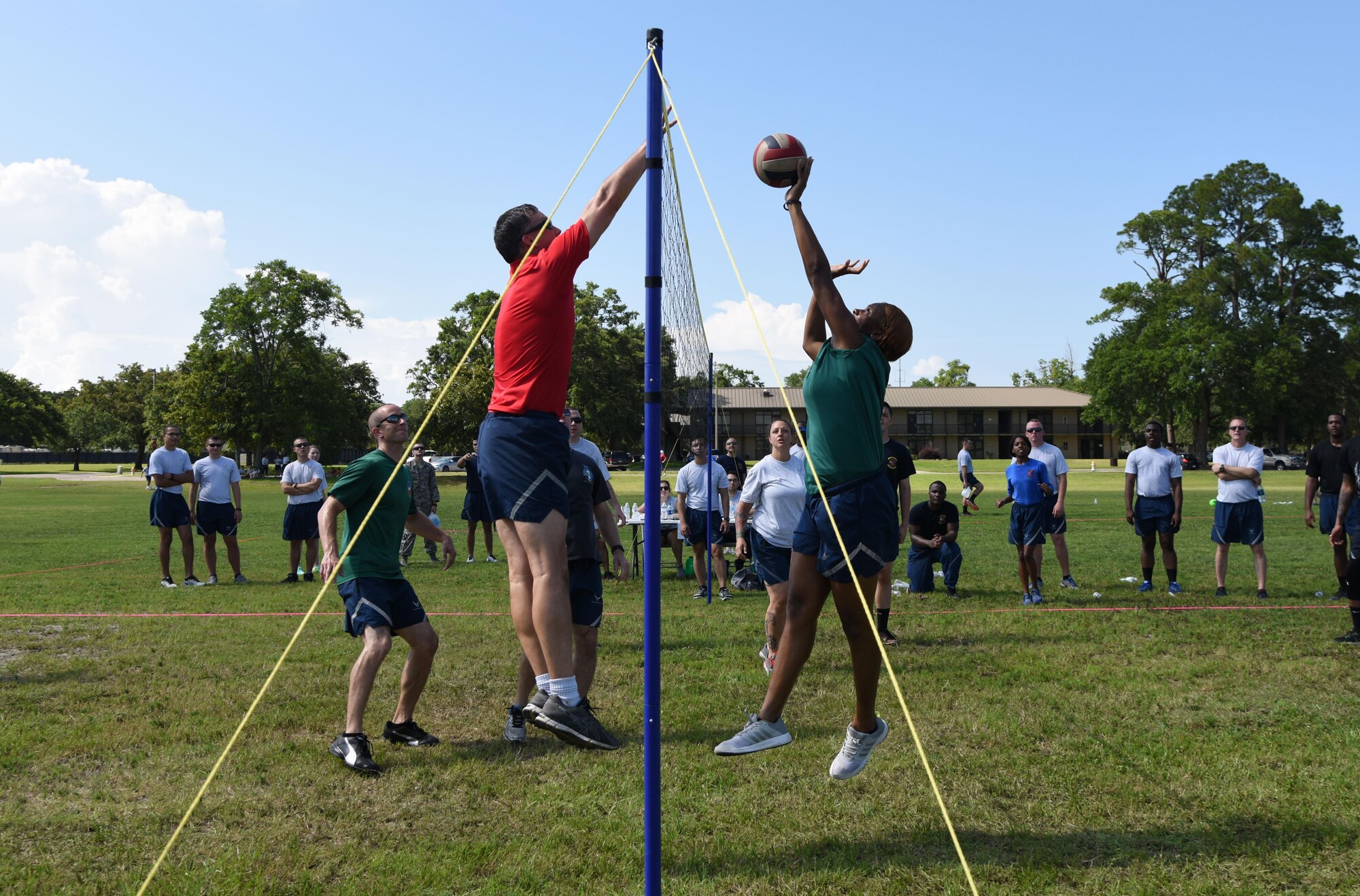 Airman 1st Class Aneesa Smith, 81st Medical Operations Squadron mental health technician, dives to hit the ball during a volleyball competition during field day June 15, 2017, on Keesler Air Force Base, Miss. Field day was the final event of Wingman Week, which focused on the physical pillar of Comprehensive Airman Fitness, resiliency and teambuilding initiatives across the base. (U.S. Air Force photo by Kemberly Groue)