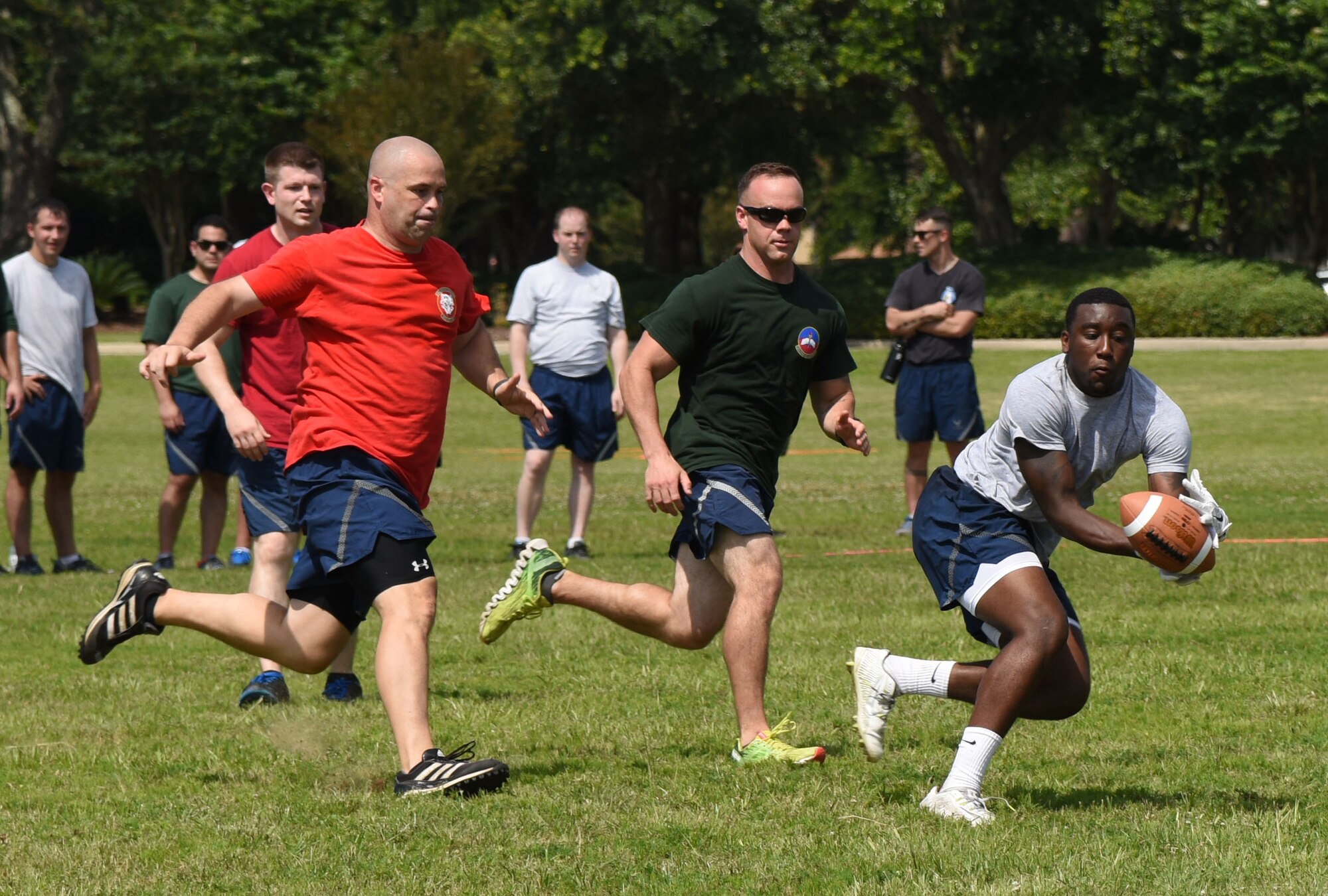 Airman Keshaun Survine, 81st Security Forces Squadron base defense operation center controller, catches the ball during an ultimate football competition during field day June 15, 2017, on Keesler Air Force Base, Miss. Field day was the final event of Wingman Week, which focused on the physical pillar of Comprehensive Airman Fitness, resiliency and teambuilding initiatives across the base. (U.S. Air Force photo by Kemberly Groue)