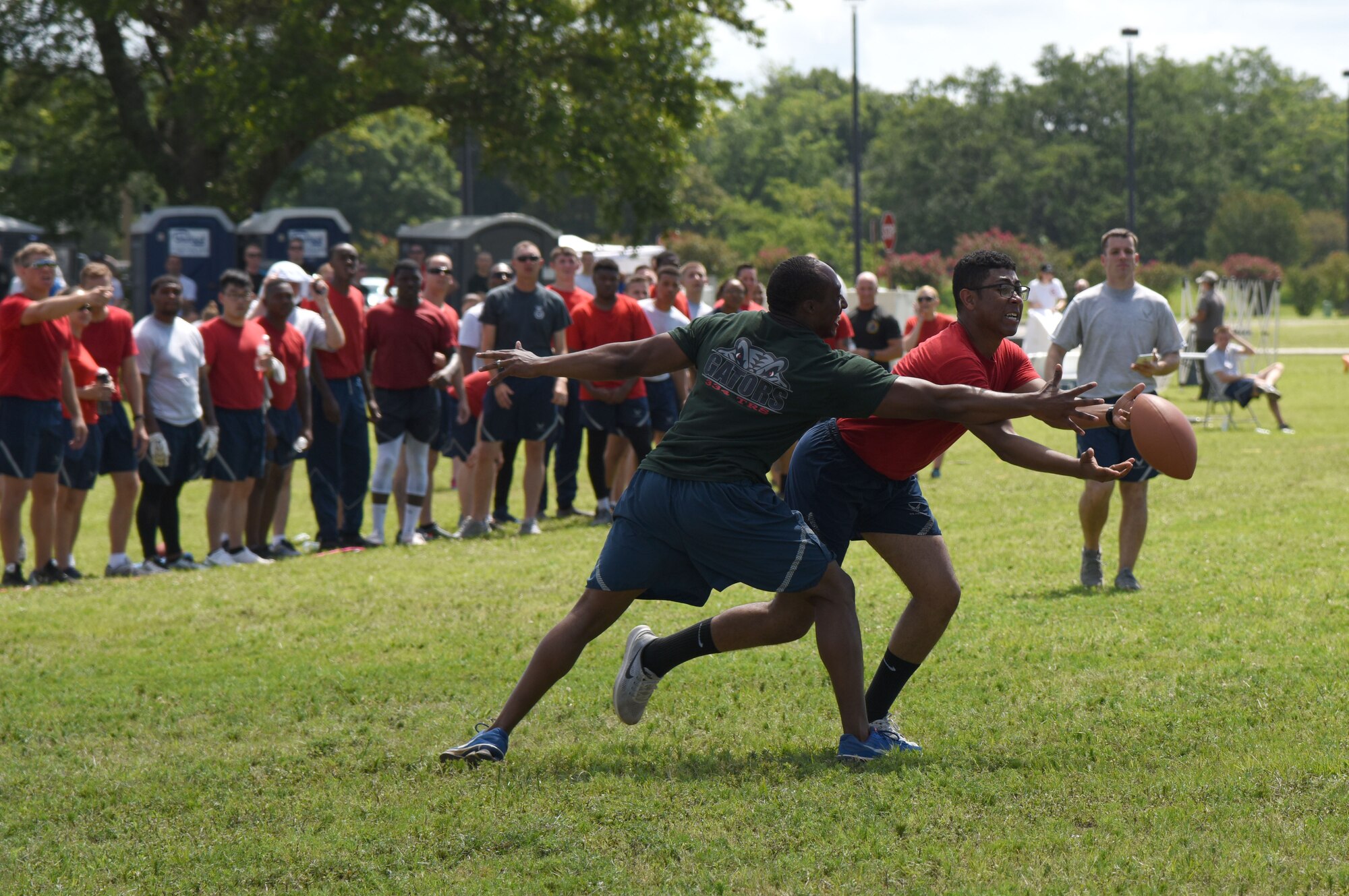 Senior Airman Cameron Spriggs, 81st Logistics Readiness Squadron logistics planner, catches the ball during an ultimate football competition during field day June 15, 2017, on Keesler Air Force Base, Miss. Field day was the final event of Wingman Week, which focused on the physical pillar of Comprehensive Airman Fitness, resiliency and teambuilding initiatives across the base. (U.S. Air Force photo by Kemberly Groue)