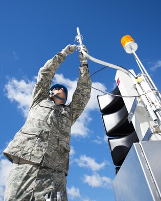 U.S. Air Force Airmen from the 210th Engineering Installation Squadron add an antenna to a newly installed Giant Voice stack located on the roof of the Small Air Terminal at the 133rd Airlift Wing in St. Paul, Minn., June 19, 2017. Once complete, the system will provide improved emergency notification capabilities to flight line and maintenance personnel while aircraft engines are running. Strobes will also light up on top of the stack as an added visual durning alerts.   
(U.S. Air National Guard photo by Tech. Sgt. Austen R. Adriaens/Released)