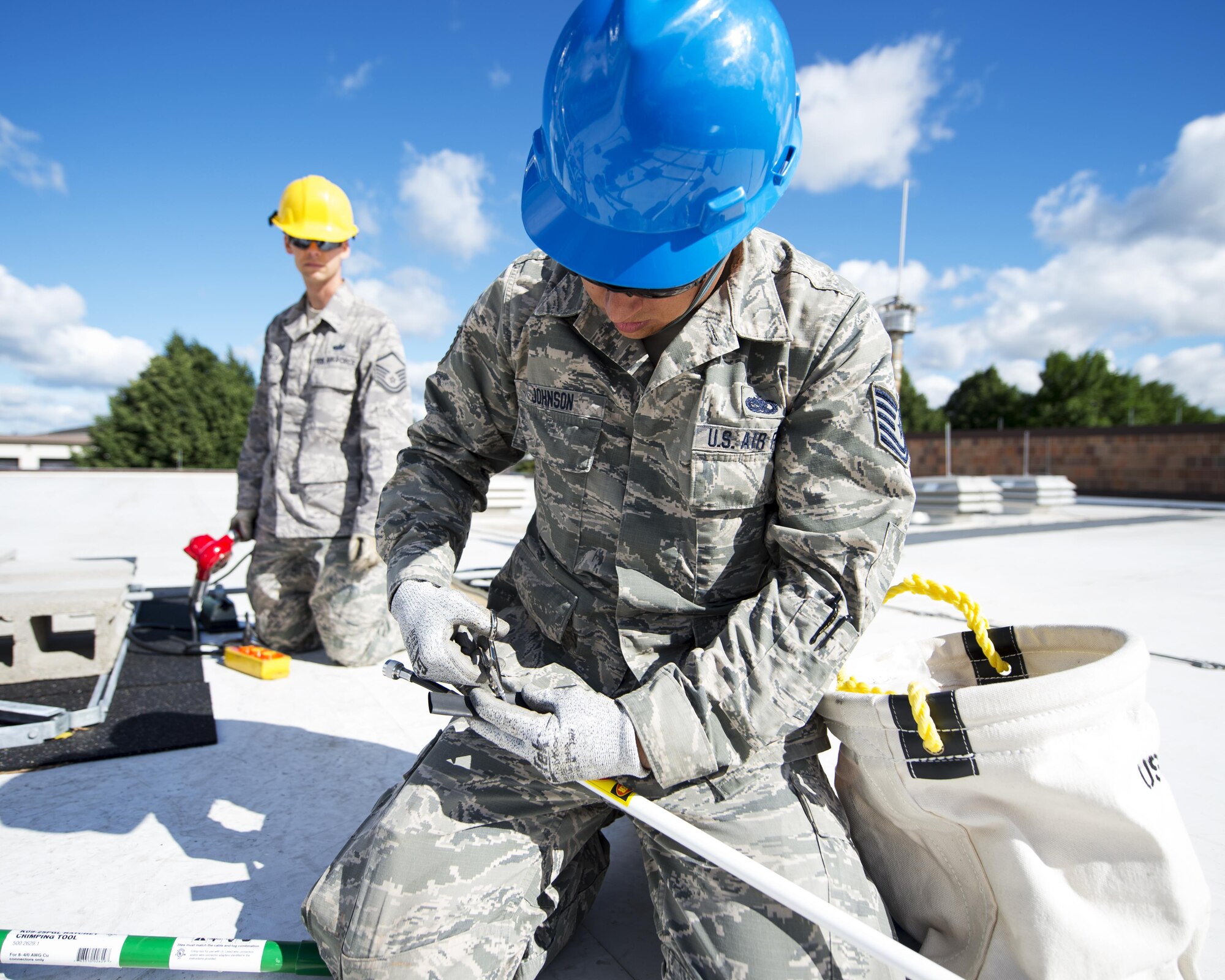 U.S. Air Force Airmen from the 210th Engineering Installation Squadron add an antenna to a newly installed Giant Voice stack located on the roof of the Small Air Terminal at the 133rd Airlift Wing in St. Paul, Minn., June 19, 2017. Once complete, the system will provide improved emergency notification capabilities to flight line and maintenance personnel while aircraft engines are running. Strobes will also light up on top of the stack as an added visual durning alerts.   
(U.S. Air National Guard photo by Tech. Sgt. Austen R. Adriaens/Released)