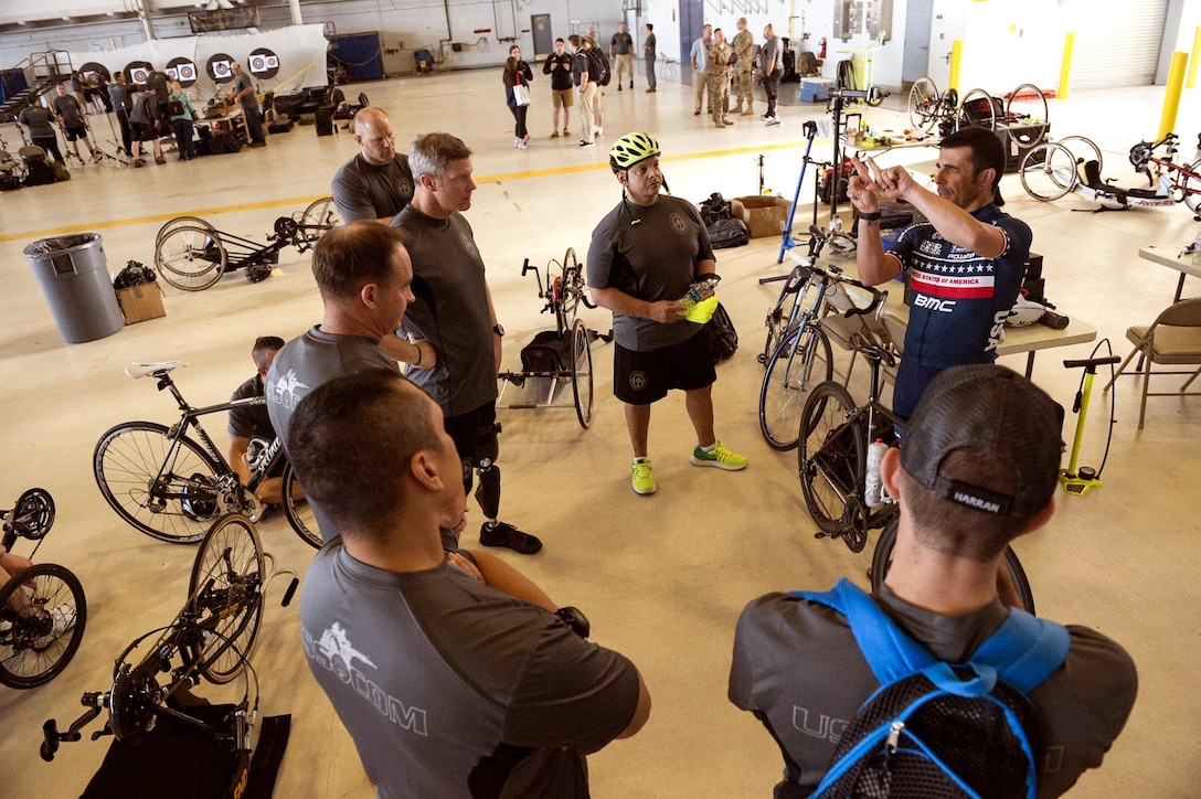 Athletes from U.S. Special Operation Command’s military adaptive sports program discuss bicycling techniques prior to a ride during Socom’s 2017 Department of Defense Warrior Games tryouts held at MacDill Air Force Base, Feb. 27, 2017.  Navy photo by Petty Officer 2nd Class J. Michael Schwartz