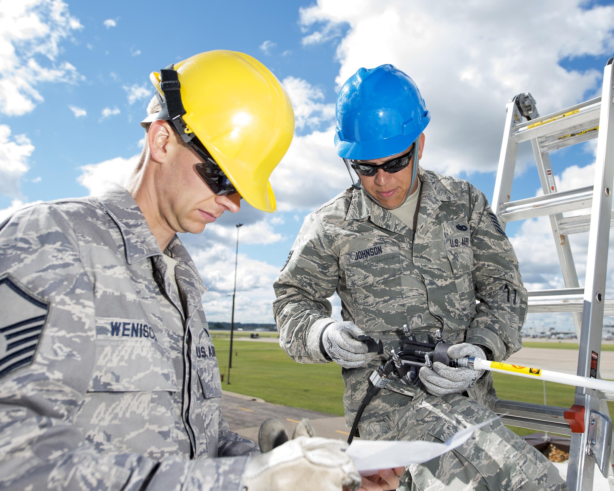 U.S. Air Force Airmen from the 210th Engineering Installation Squadron add an antenna to a newly installed Giant Voice stack located on the roof of the Small Air Terminal at the 133rd Airlift Wing in St. Paul, Minn., June 19, 2017. Once complete, the system will provide improved emergency notification capabilities to flight line and maintenance personnel while aircraft engines are running. Strobes will also light up on top of the stack as an added visual durning alerts.   
(U.S. Air National Guard photo by Tech. Sgt. Austen R. Adriaens/Released)