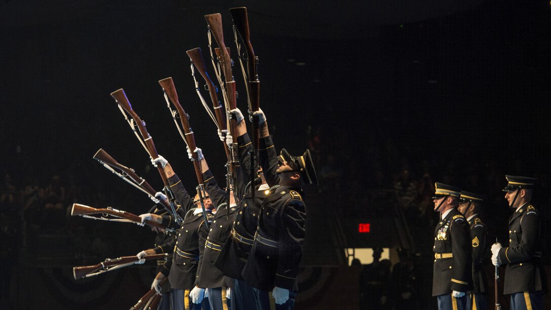 U.S. Army Drill Team members perform during a twilight tattoo event at Joint Base Myer-Henderson Hall, Va., June 14, 2017. Twilight tattoos are hourlong military performances. Army photo by Staff Sgt. Austin L. Thomas