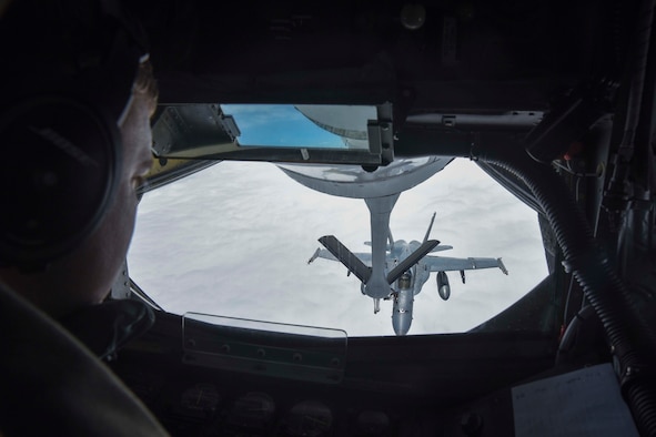 U.S. Air Force Senior Airman Jeffrey Jaskela, 350th Air Refueling Squadron boom operator, refuels a U.S. Marine Corps F-18 Hornet, above Canada, during Red Flag-Alaska (RF-A) 17-2, June 12, 2017. Four aircrew members from McConnell Air Force Base, Kan., took two KC-135 Stratotankers to Eielson Air Force Base, Alaska, to provide warfighting support during the 2-week exercise that aims to develop and improve U.S. and partner nation combat readiness and combined interoperability. (U.S. Air Force photo/Senior Airman Chris Thornbury)