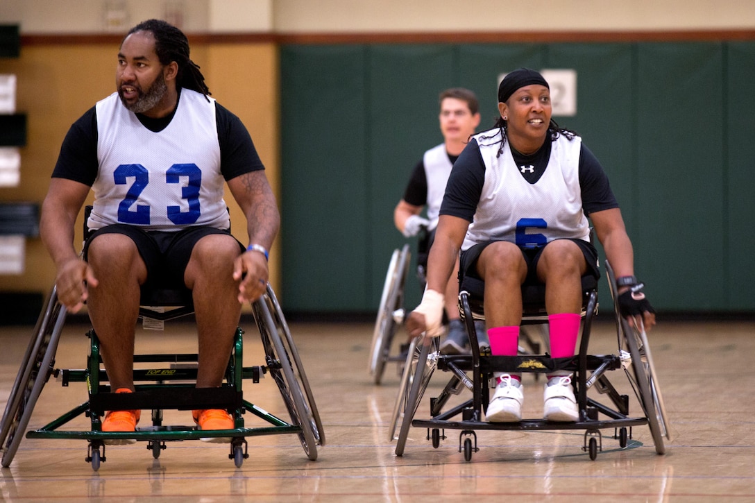 Army veteran Daniel Shegog and Army Master Sgt. Jovan Bowser, from Fort Bragg, Ga., train for the Warrior Care and Transition's Army Trials wheelchair basketball event at Fort Bliss, Texas, March 31, 2017. About 80 wounded, ill and injured active-duty soldiers and veterans are competing in eight different sports April 2-6 for the opportunity to represent Team Army at the 2017 Defense Department Warrior Games. Army photo by Pfc. Genesis Gomez