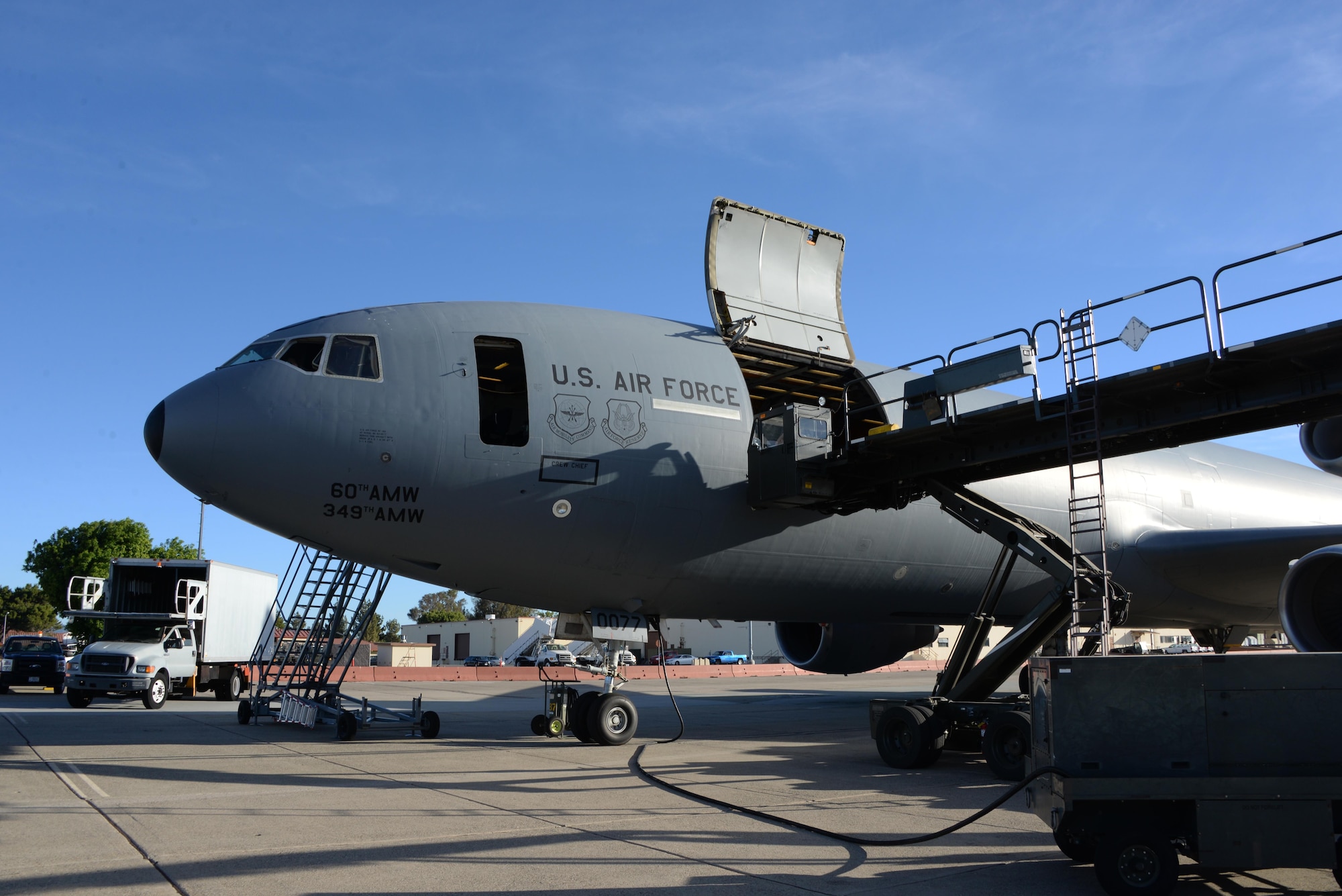 A KC-10 Extender is loaded with 15,000 pounds of cargo at Travis Air Force Base, Calif., June 17, 2017, prior to a flight to Joint Base Pearl Harbor-Hickam, Hawaii. The aircraft is capable of transporting 170,000 pounds of cargo. (U.S. Air Force photo/Tech. Sgt. James Hodgman)