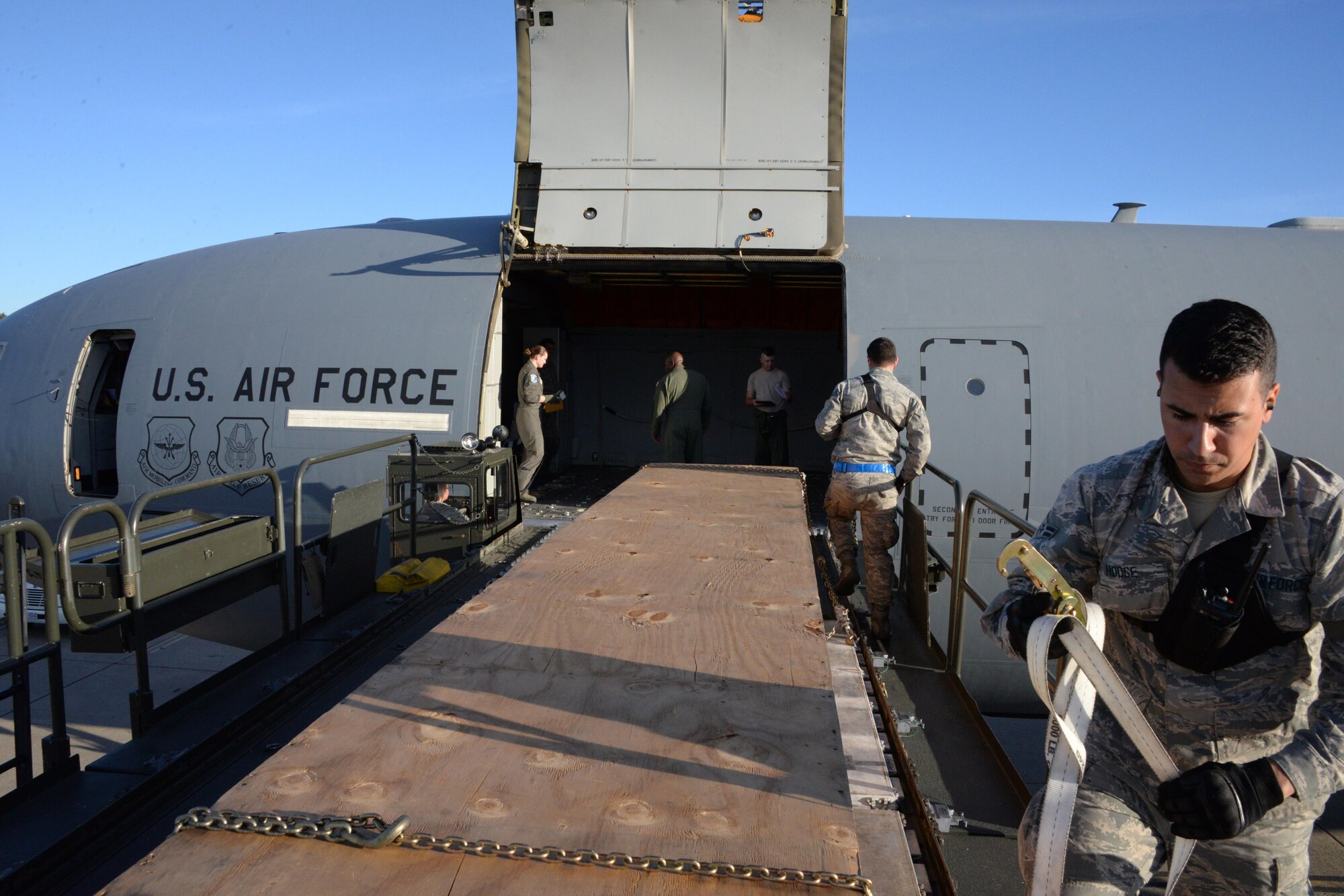 Airman 1st Class James Hodge III, 60th Aerial Port Squadron, prepares to load a pallet onto a KC-10 Extender at Travis Air Force Base, Calif., June 17, 2017. Hodge helped load more than 15,000 pounds of cargo prior to a flight to Joint Base Pearl Harbor-Hickam, Hawaii. (U.S. Air Force photo by Tech. Sgt. James Hodgman)