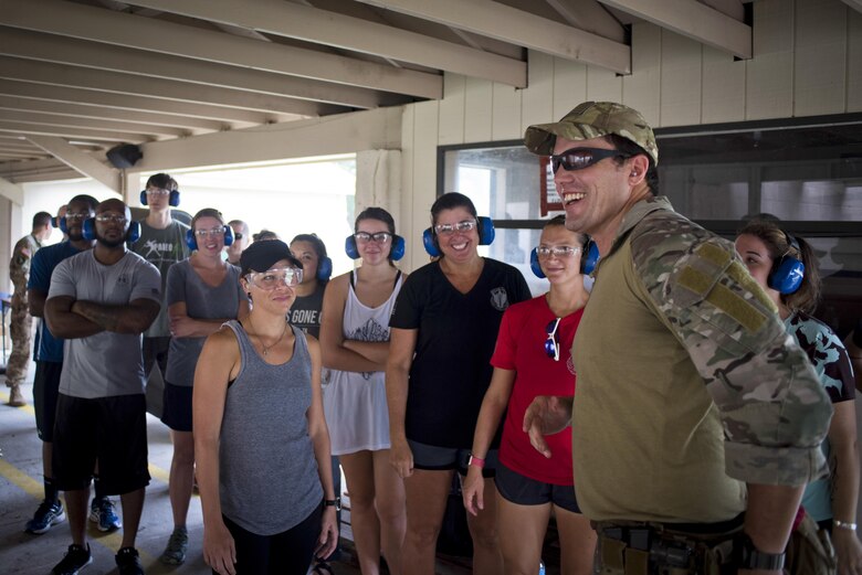 Special Operations Command Central spouses are briefed on proper gun safety and control as part of Spartan Spouse Day held at MacDill Air Force Base, Fla., June 13, 2017. The spouses learned how to fire handguns as an opportunity to experience the training their military spouses go through. (U.S. Air Force photo by Staff Sgt. Ned Johnston)