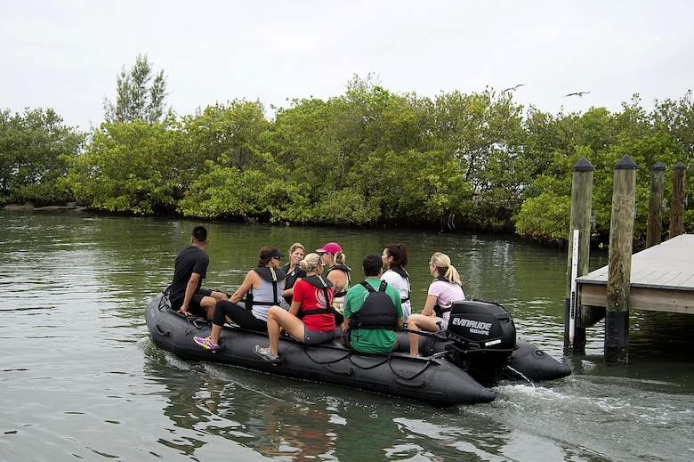 Spouses from Special Operations Command Central ride on a Zodiac, an inflatable boat, as part of Spartan Spouse Day held at MacDill Air Force Base, Fla., June 13, 2017. The day included inflatable-boat familiarization as an opportunity to experience the training their spouses have gone through. (U.S. Air Force photo by Airman 1st Class Caleb Nunez)