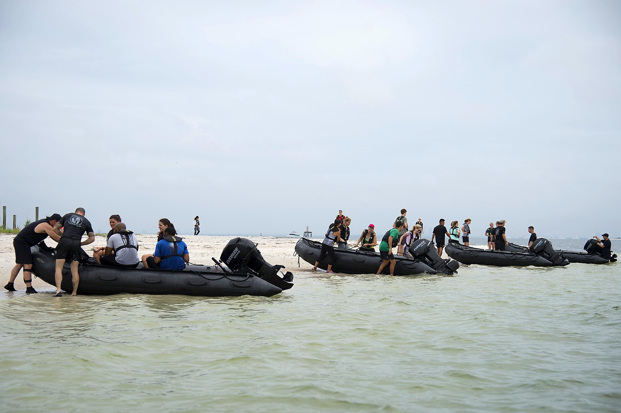 Spouses from Special Operations Command Central arrive on the shore of Pine Key, Fla., as part of Spartan Spouse Day, June 13, 2017. The spouses learned how to mount and dismount Zodiac inflatable boats and their use in special operation missions. (U.S. Air Force photo by Airman 1st Class Caleb Nunez)