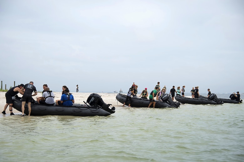 Spouses from Special Operations Command Central arrive on the shore of Pine Key, Fla., as part of Spartan Spouse Day, June 13, 2017. The spouses learned how to mount and dismount Zodiac inflatable boats and their use in special operation missions. (U.S. Air Force photo by Airman 1st Class Caleb Nunez)