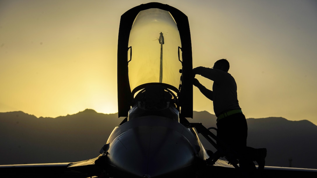 Air Force Senior Airman Alexis Garrido removes paint from an F-16 Fighting Falcon at Bagram Airfield, Afghanistan, June 16, 2017. Garrido is a dedicated crew chief assigned to the 455th Expeditionary Aircraft Maintenance Squadron. Air Force photo by Staff Sgt. Benjamin Gonsier
