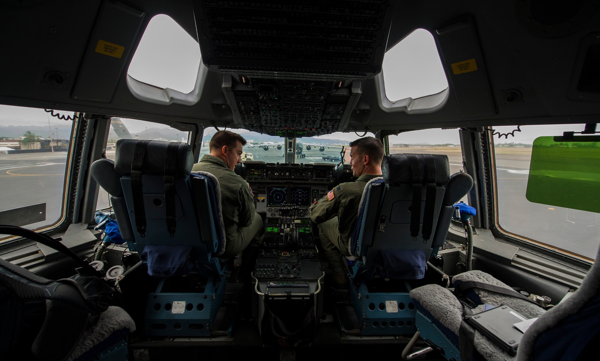 Col. Charles Velino, 15th Operations Group commander, and  Maj. Justin Carmona, 535th Operations Support Squadron pilot, conduct pre-flight checks onboard a C-17 Globemaster III for Velino’s final flight at Joint Base Pearl Harbor-Hickam, Hawaii, June 16, 2017.  Velino is a command pilot with over 3,500 flying hours and will be leaving the 15th Operations Group to take command of the 47th Flying Training Wing in Laughlin AFB, Texas. (U.S. Air Force photo by Tech Sgt. Heather Redman)
