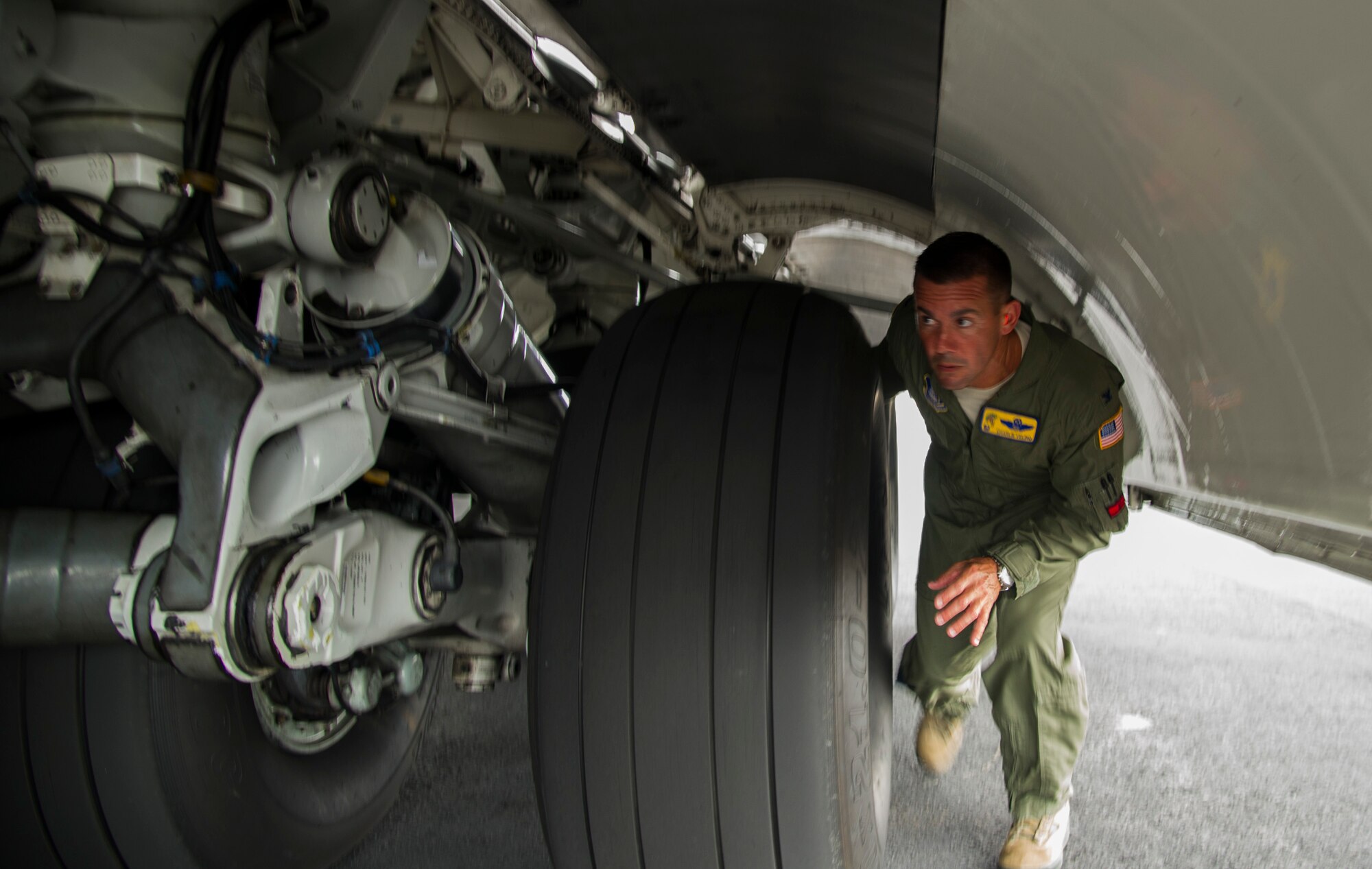 Col. Charles Velino, 15th Operations Group commander, does a pre-flight inspection of a C-17 Globemaster III before his final flight at Joint Base Pearl Harbor-Hickam, Hawaii, June 16, 2017.  Velino is a command pilot with over 3,500 flying hours and will be leaving the 15th Operations Group to take command of the 47th Flying Training Wing in Laughlin AFB, Texas. (U.S. Air Force photo by Tech Sgt. Heather Redman)