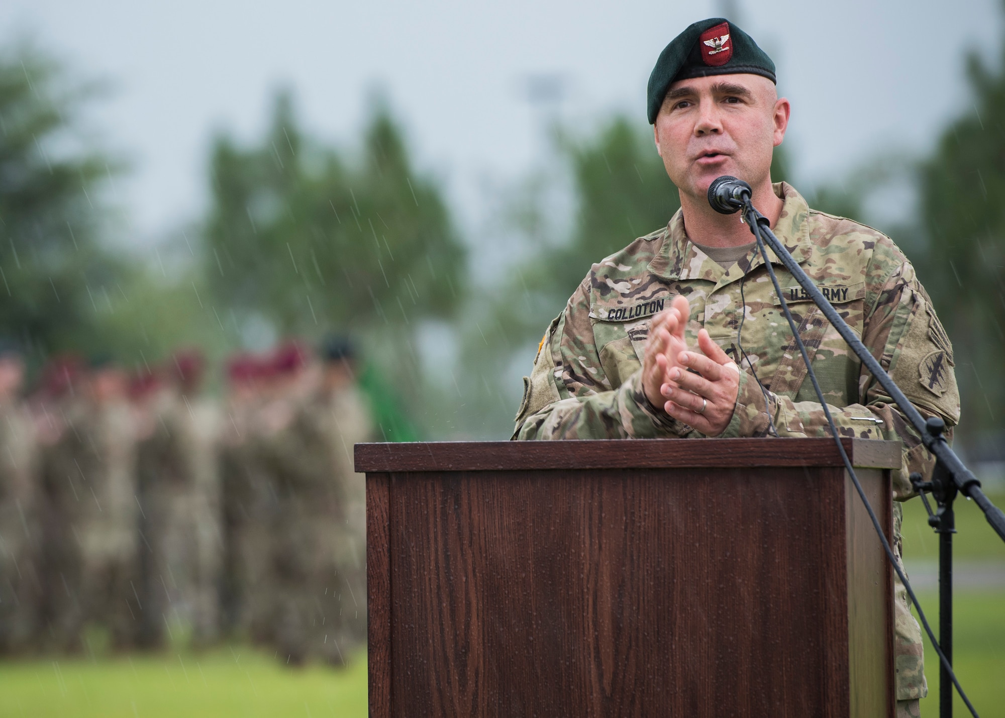 U.S. Army Col. Patrick Colloton, incoming commander, 7th Special Forces Group (Airborne), addresses the audience during a Florida thunderstorm at a change of command ceremony June 15 at Eglin Air Force Base, Fla. During the ceremony Col. Michael Ball relinquished command of the 7th SFG(A) to Col. Patrick Colloton. Colloton previously served as the 7th SFG(A) 1st Battalion commander. (U.S. Air Force photo/Ilka Cole)