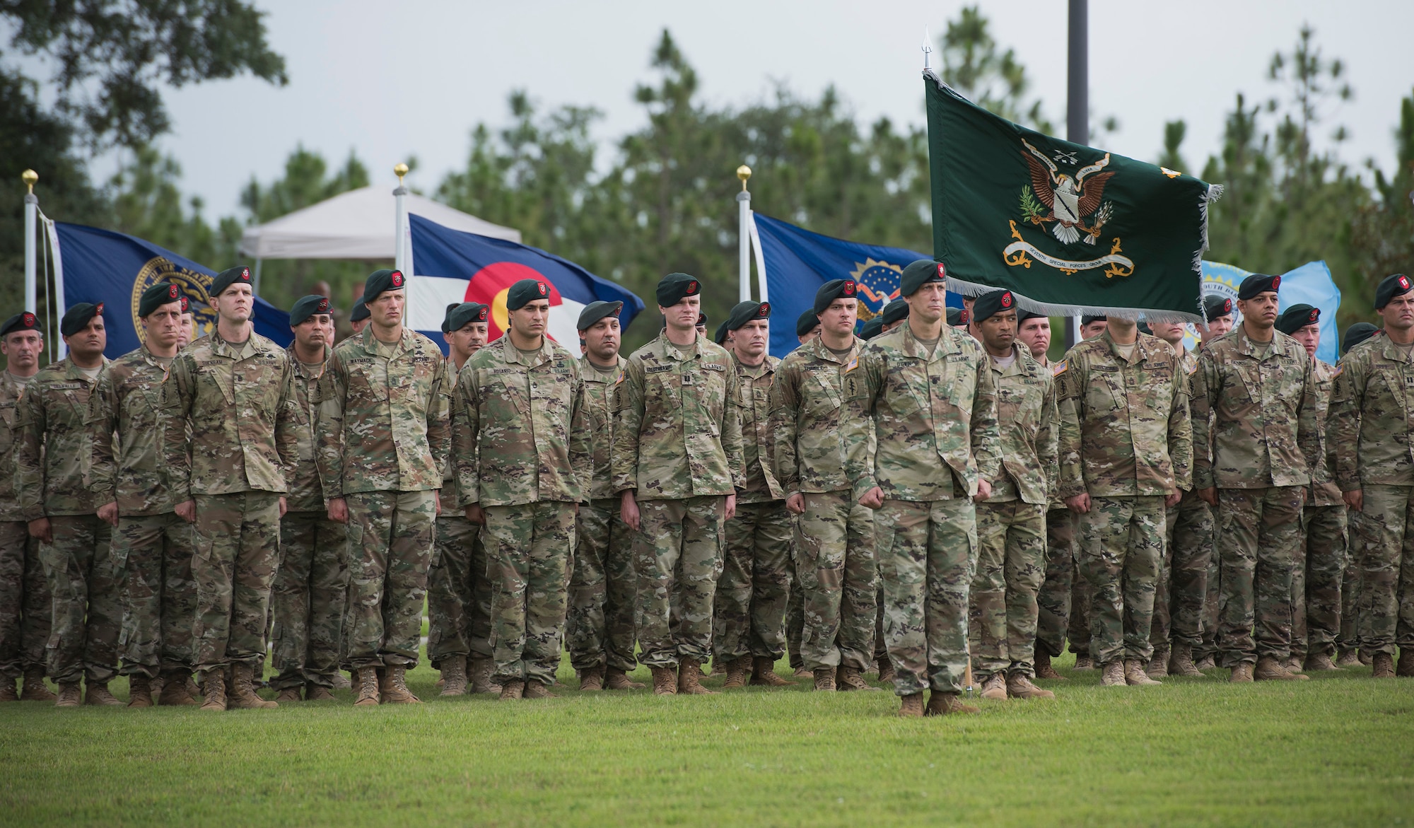 Green Berets from the 7th Special Forces Group (Airborne) stand at attention during a change of command ceremony June 15 at Eglin Air Force Base, Fla. During the ceremony Col. Michael Ball relinquished command of the 7th SFG(A) to Col. Patrick Colloton. Colloton previously served as the 7th SFG(A) 1 st Battalion commander. (U.S. Air Force photo/Ilka Cole) 