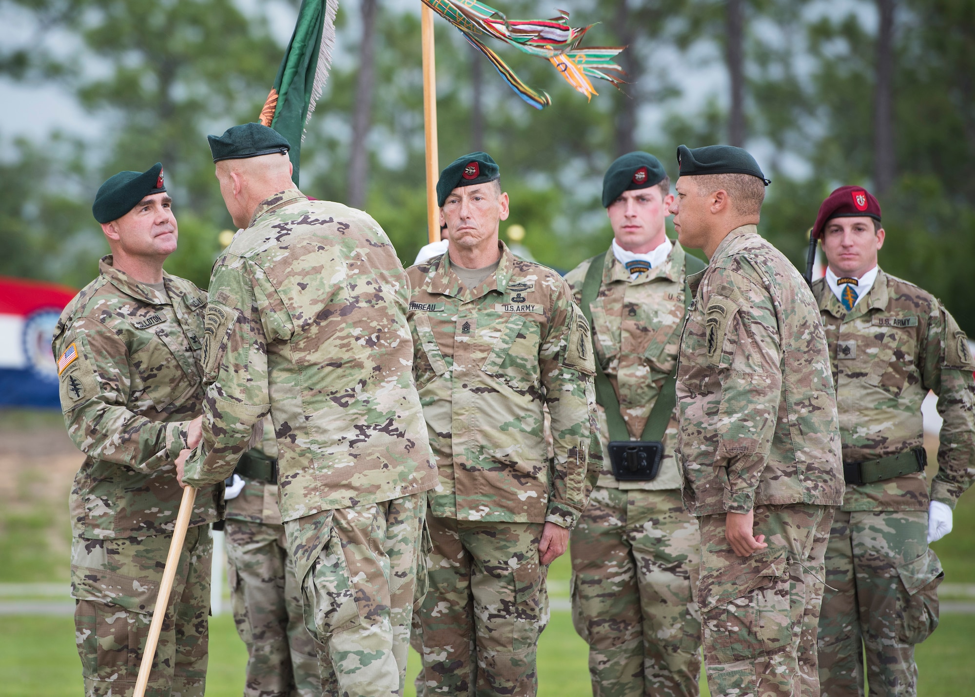 U.S. Army Col. Patrick Colloton, incoming commander, accepts command of the 7th Special Forces Group (Airborne) from Brig. Gen. Edwin J. Deedrick,commanding general 1st Special Forces Command (Airborne) as CSM Mark Thibeau and Col. Michael Ball, outgoing commander look on during a change of command ceremony June 15 at Eglin Air Force Base, Fla. During the ceremony Col. Michael Ball relinquished command of the 7th SFG(A) to Col. Patrick Colloton. The passing of the Group’s colors marks the change of command. (U.S. Air Force photo/Ilka Cole)