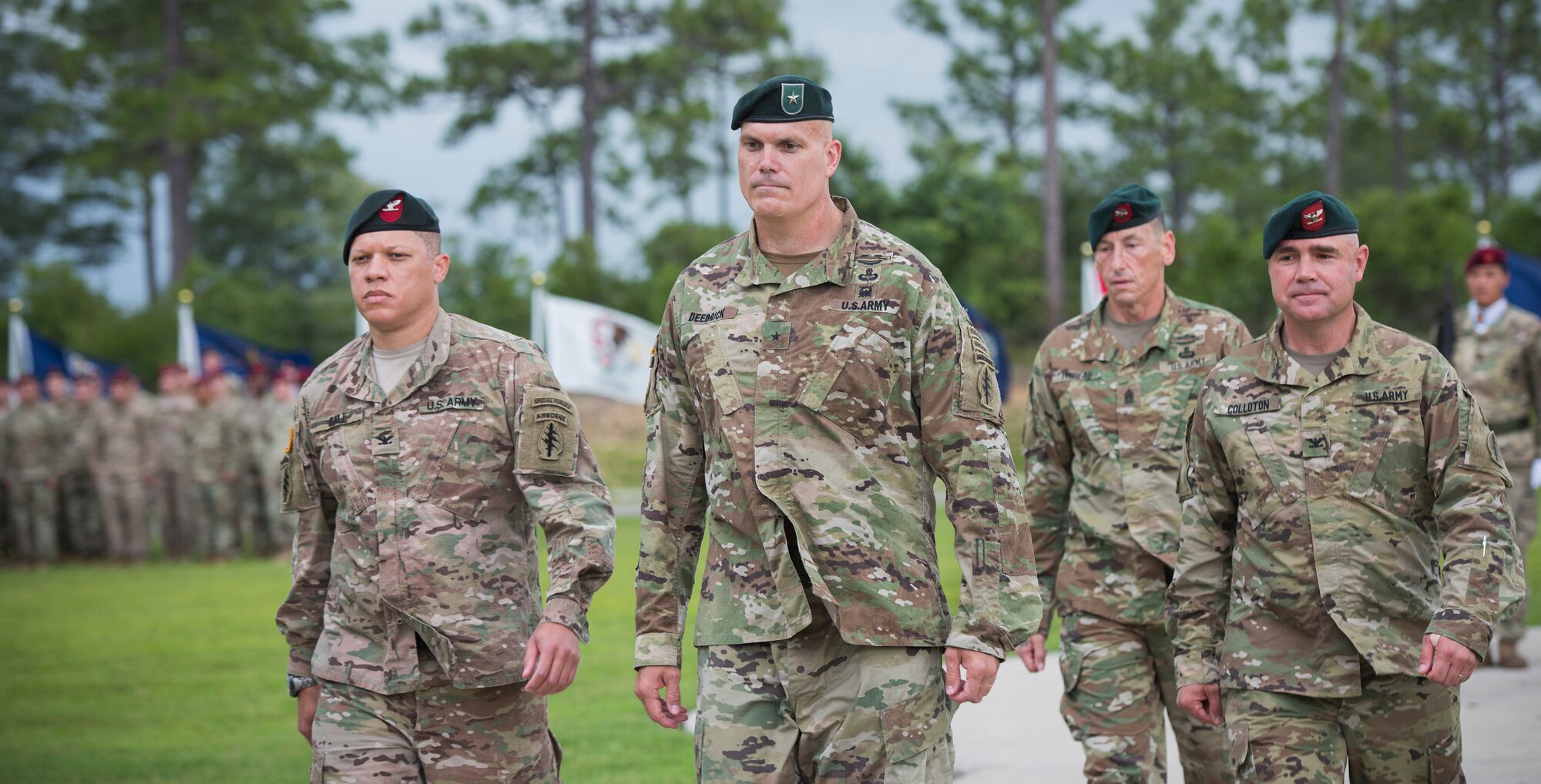 Special Forces leadership return to their seats after the passing of the Group colors during a change of command ceremony June 15 at Eglin Air Force Base, Fla. During the ceremony Col. Michael Ball relinquished command of the 7th SFG(A) to Col. Patrick Colloton. The passing of the Group’s colors marks the change of command. (U.S. Air Force photo/Ilka Cole)