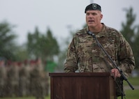 U.S. Army Brig. Gen. Edwin J. Deedrick, commanding general 1st Special Forces Command (Airborne) addresses the audience during a Florida thunderstorm at a change of command ceremony June 15 at Eglin Air Force Base, Fla. During the ceremony Col. Michael Ball relinquished command of the 7th SFG(A) to Col. Patrick Colloton. (U.S. Air Force photo/Ilka Cole) 