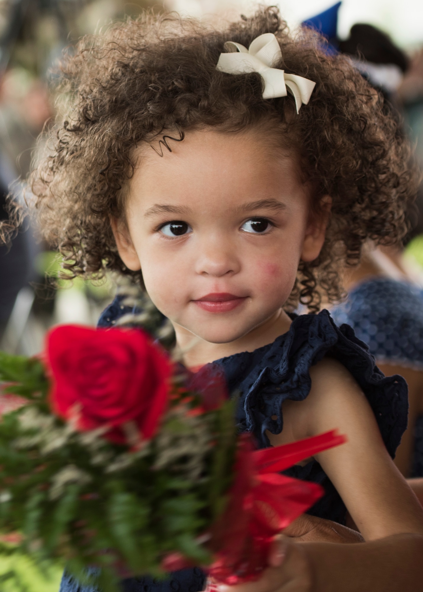 The daughter of Col. Michael Ball, proudly tells the audience that’s “her Daddy” during a change of command ceremony June 15 at Eglin Air Force Base, Fla. During the ceremony Col. Michael Ball relinquished command of the 7th SFG(A) to Col. Patrick Colloton. (U.S. Air Force photo/Ilka Cole) 