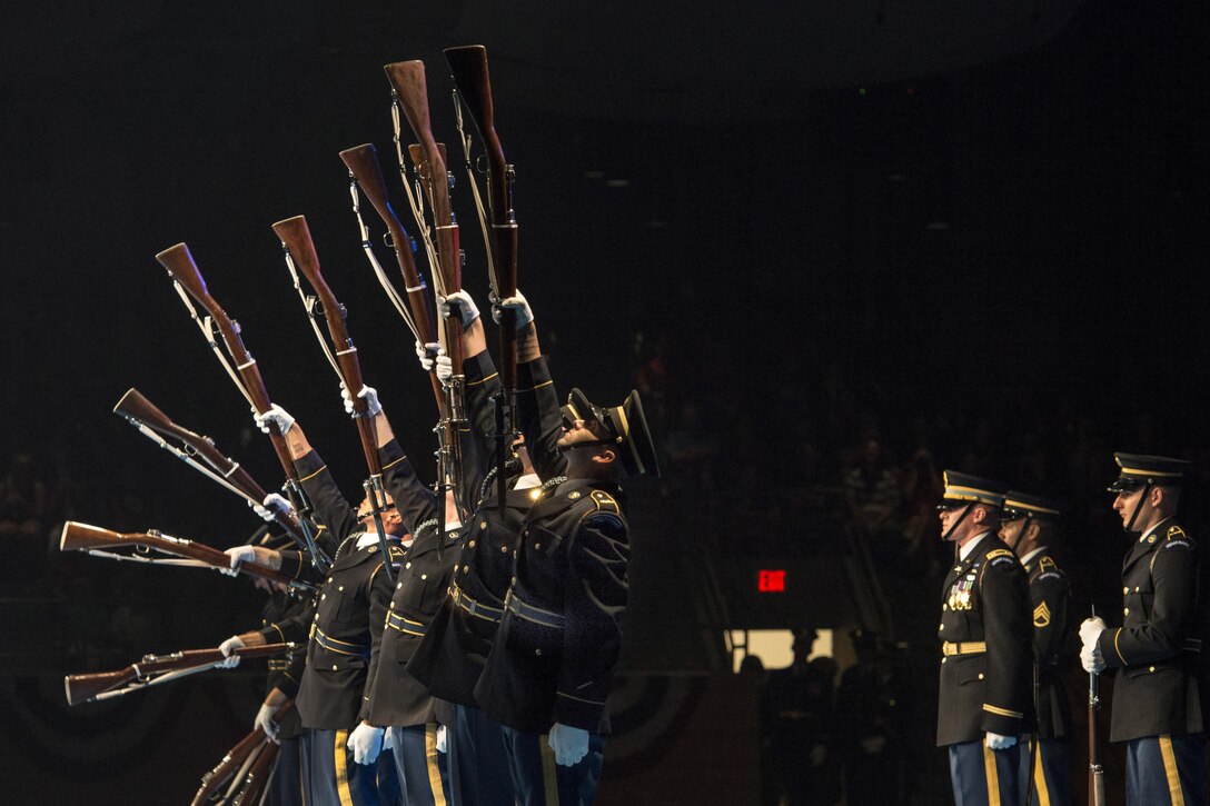 U.S. Army Drill Team members perform during a twilight tattoo event at Joint Base Myer-Henderson Hall, Va., June 14, 2017. Twilight tattoos are hourlong military performances. Army photo by Staff Sgt. Austin L. Thomas